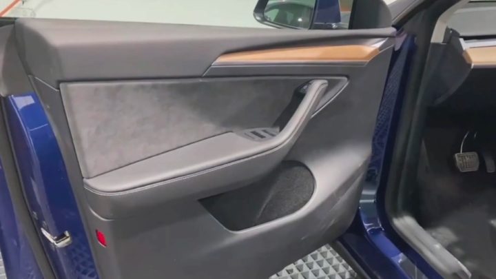 Image of the interior of the Tesla Model Y driver's door
